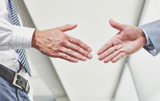 Photo of hands of business partners before handshake